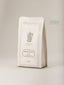 Paquet de café Grand Pavois 250g de Verlet, mélange arabica création 1921, emballage blanc cassé avec pichet illustré