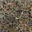Feuilles de thé Pu'er cru Sheng Cha séchées, récolte automne Yunnan, notes végétales et zestées